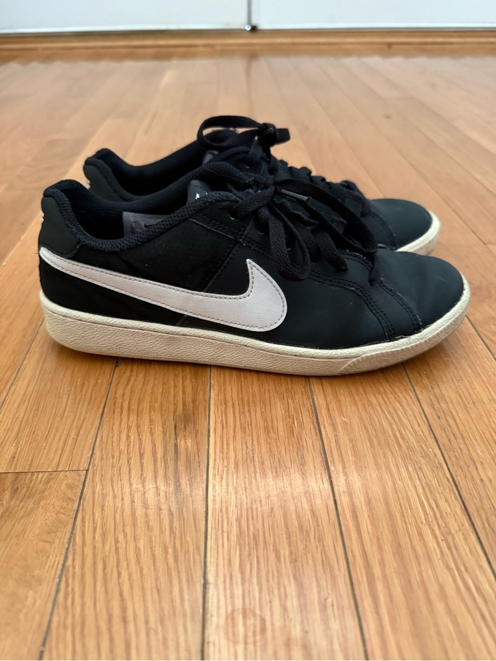 Nike Black Low-Top Sneakers with White Swoosh